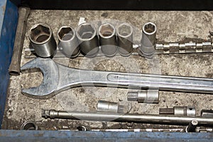 Box with old and dirty, rusty keys,spanner.