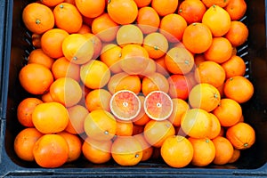 box of oranges with vitamin C essential to deal the ailments of