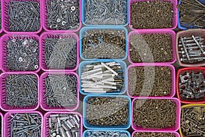Box organizer for the screws, bolts, spacers and dowels for sell in street market in Hanoi, Vietnam, close up