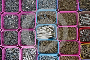 Box organizer for the screws, bolts, spacers and dowels for sell in street market in Hanoi, Vietnam, close up