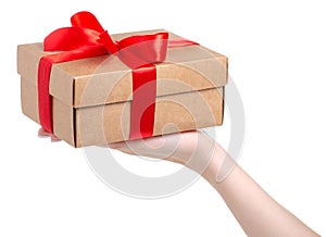 Box with red ribbon bow gift in hand