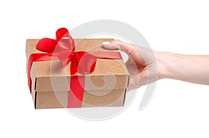 Box with red ribbon bow gift in hand