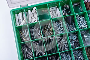 Box with screws, nails, clamps in different sizes