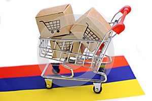 Box with shopping cart logo and Armenia flag : Import Export Shopping online or eCommerce delivery service store product shipping