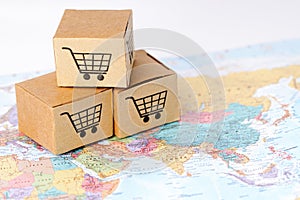 Box with shopping cart logo on Asia map