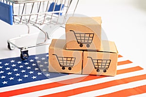 Box with shopping cart logo and USA America flag, Import Export Shopping online or eCommerce finance delivery service store