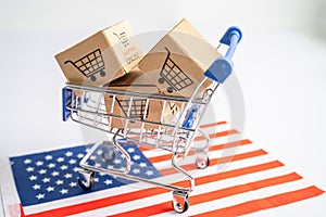 Box with shopping cart logo and USA America flag, Import Export Shopping online or eCommerce finance delivery service store