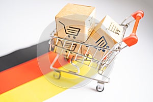 Box with shopping online cart logo and Germany flag, Import Export commerce finance delivery trade