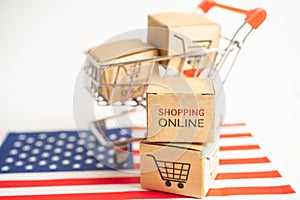 Box with shopping online cart logo and USA America flag, Import Export Shopping online or commerce finance delivery service store