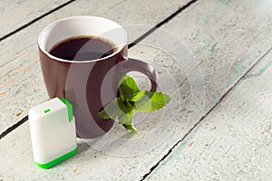 Box of stevia tablets and coffee