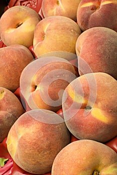 Box of tree ripe peaches