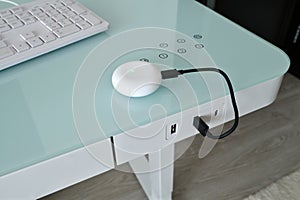Box for wireless headphones is charged from the USB table