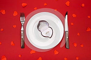 Box witha ring, table setting on a red background. Concept Valentine`s Day. - Image photo