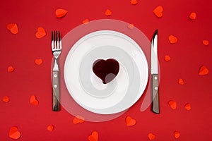 Box witha ring, table setting on a red background. Concept Valentine`s Day. - Image photo