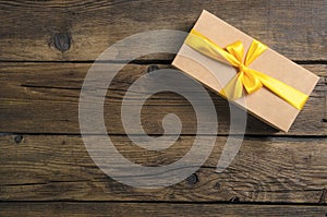 Box with yellow ribbon bow gift