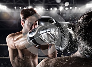 Boxer in a box competition beats his opponent