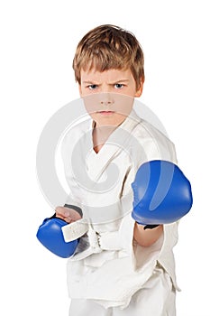 Boxer boy in white and blue boxing gloves fighting