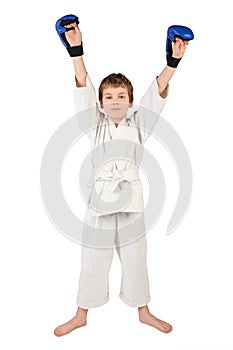 Boxer boy in white dress and blue boxing gloves