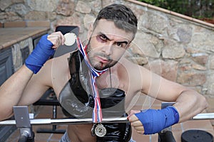 Boxer with hematomas winning a medal