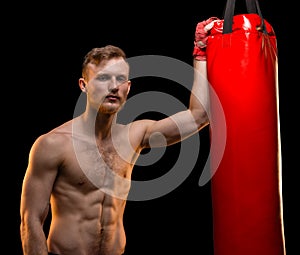 Boxer man with punching bag