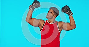 Boxer, man and winner in sports studio isolated on a blue background mockup. Athlete, boxing and face portrait of happy