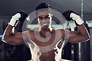 Boxer, portrait and gym with flex, boxing ring and smile for workout or training. Man, exercise and fitness for health