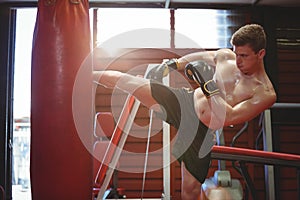 Boxer practicing kickboxing