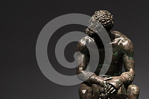 Boxer pugilist greek copper statue in Rome