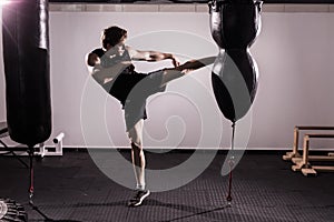 Boxer With Punch Bag In Action - A Man With A Tattoo In Red Boxing Gloves - Boxing