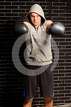 Boxer punching with both fists towards the camera