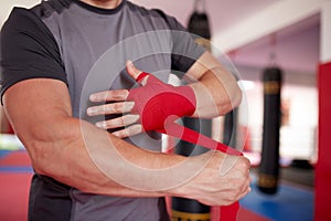 Boxer putting handwraps on