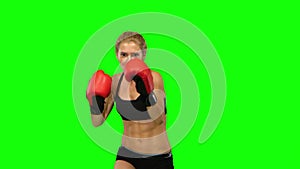 Boxer standing in the front and sends butted an opponent standing on the spot. Green screen. Close up