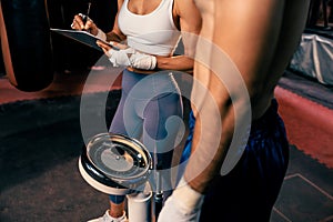 Boxer step on weight scale for boxing class designation. Impetus