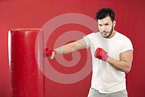 Boxer in training on a punching bag