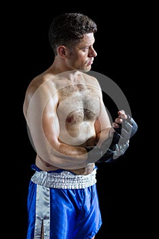 Boxer wearing grappling gloves photo