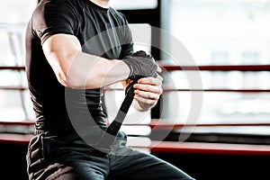 Boxer winding bandage on the wrists