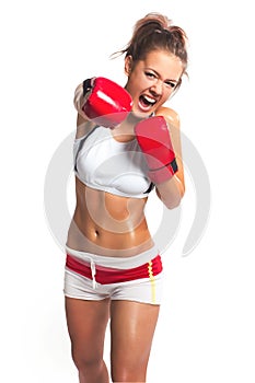 boxer woman during boxing exercise making direct hit with red gloves
