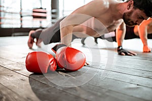 Boxers doing push-ups at the gym