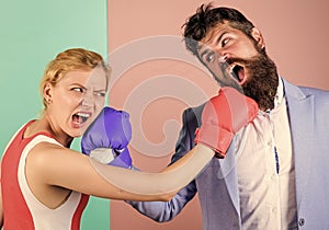 Boxers fighting in gloves. Domination concept. Gender equality. Man and woman boxing fight. Couple in love competing in