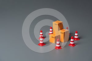 Boxes bounded by traffic cones. Cargo seizure and export restrictions. photo