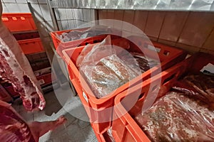Boxes and containers with packaged meat for storage and transportation.