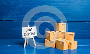 Boxes and easel with Drop Shipping. Business model and supply chain management. Expanding of ways of selling goods. Engaging