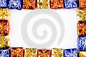 Boxes with gifts on a white background with copy space for text. Greeting card frame. Golden box with gift. Christmas gift boxes.