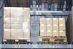 Boxes of goods on pallets on the shelves of a warehouse warehouse. Goods in stock, store storage organization