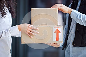 Boxes, hands or woman with package, delivery man or cargo with freight, stock and distribution. Sales, customer and