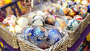 Boxes with ornamental Christmas baubles. Set of wicker boxes with various traditional Christmas balls placed on stall in