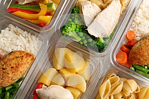 Boxes with prepared meals as background,  lay