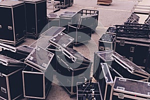 Boxes stage equipment for a concert on wood and old brick