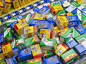 Boxes of various brands of film in a bin at a store including Kodak,FujiFilm, and Konica