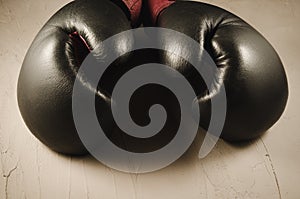 Boxing concept with gray gloves/boxing concept with gray gloves on a stone background